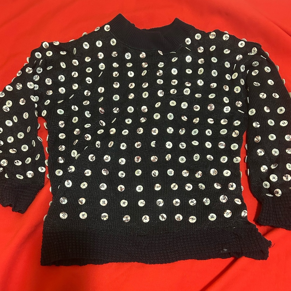 Real buttons sweater! Black with sewn real buttons! Great unique sweater. Medium
